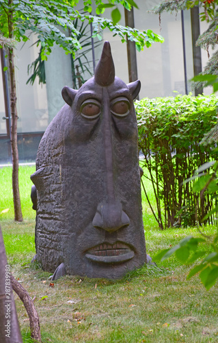 Photography The sculpture of a mythical animal as an element of landscape architecture of the square