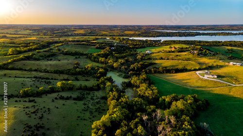 Nebraska drone landscape photography of the countryside and ranch with trees and water