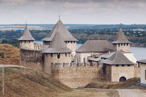 Khotyn Fortress complex  Ukraine. A medieval Romanesque castle protected by a stone fortress and a river on one side. Stone beautiful castle on the mountain