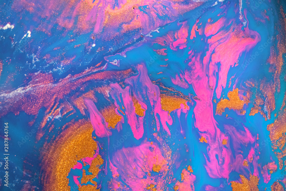 Abstract created using the technique of liquid acrylic. Macro photography of the smallest details of a picture. The picture shows how overflows of shades and colors of paint resemble space motifs.