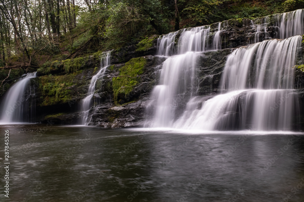 Low level view with a long exposure shot of waterfall, in the Brecon Beacons, Wales scenic waterfall with flowing water