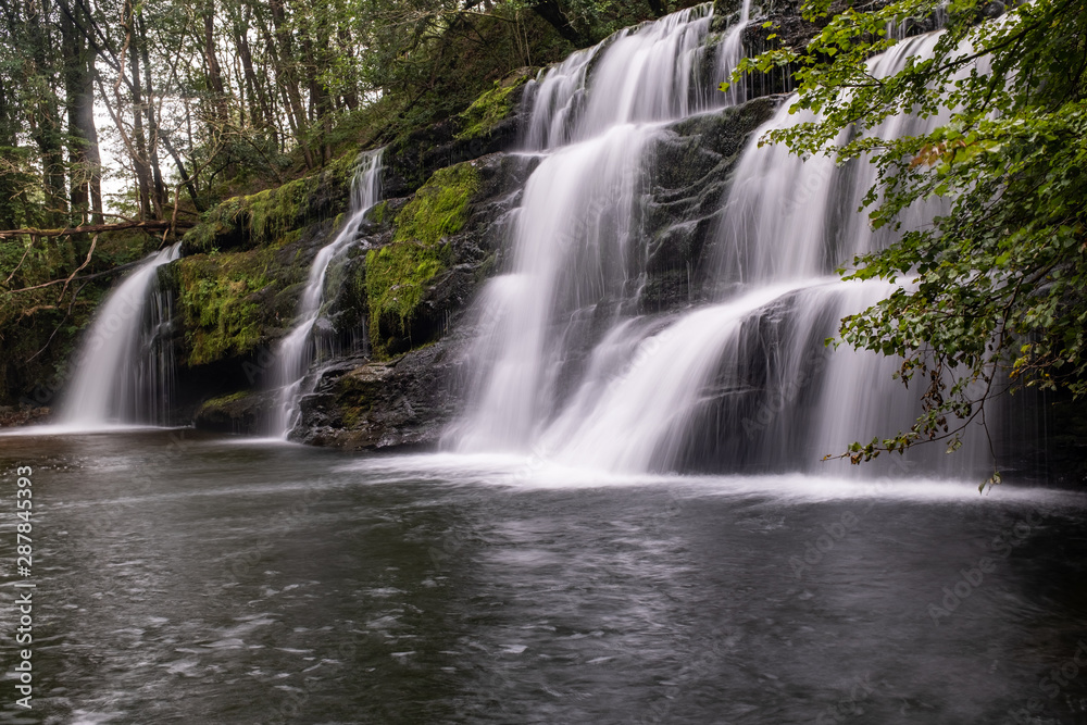 Long exposure shot of waterfall, in the Brecon Beacons, Wales scenic waterfall with flowing water Long exposure shot of waterfall, in the Brecon Beacons, Wales scenic waterfall with flowing water