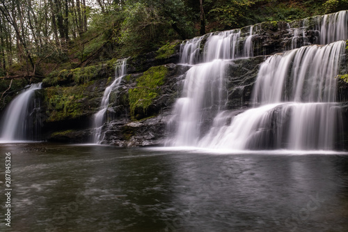 Low level view with a long exposure shot of waterfall  in the Brecon Beacons  Wales scenic waterfall with flowing water