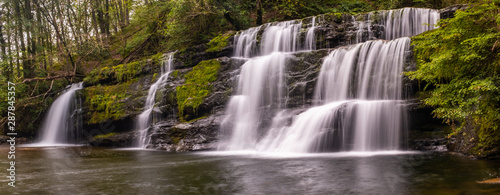 Panoramic view with long exposure shot of waterfall, in the Brecon Beacons, Wales scenic waterfall with flowing water
