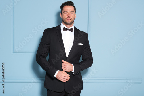 Photography Handsome man in black classy suit.