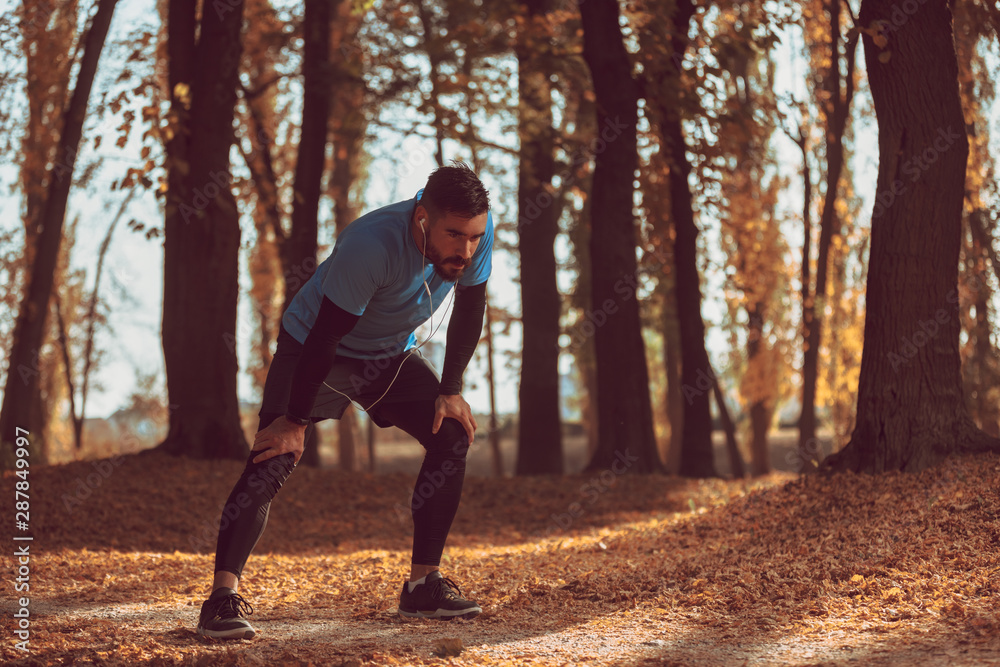 Obraz premium Handsome man are stretching before running.