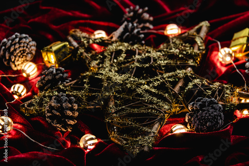 Christmas decoration, star and lights on red velvet