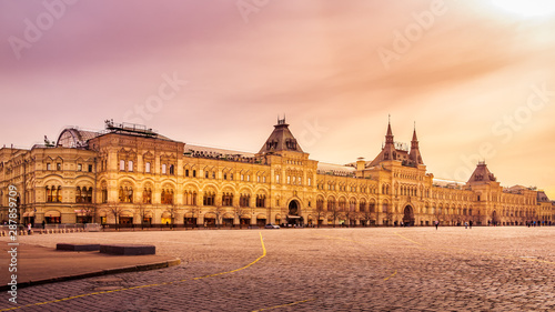Panoramic, wide view at the Red Square and GUM shopping mall with few tourists, early hours and beautiful sunrise, Moscow, Russia