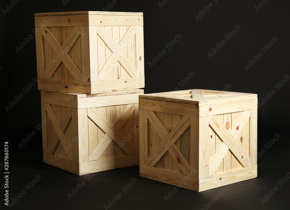 Group of wooden crates on black background