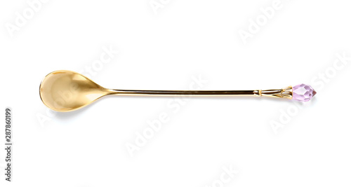 Stylish clean gold spoon on white background, top view