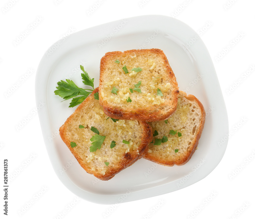 Slices of toasted bread with garlic and herb on white background, top view Slices of toasted bread with garlic and herb on white background, top view