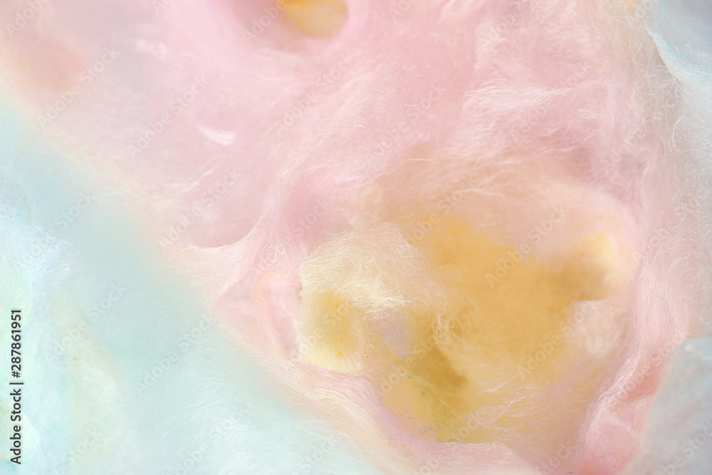 Sweet colorful cotton candy as background, closeup view