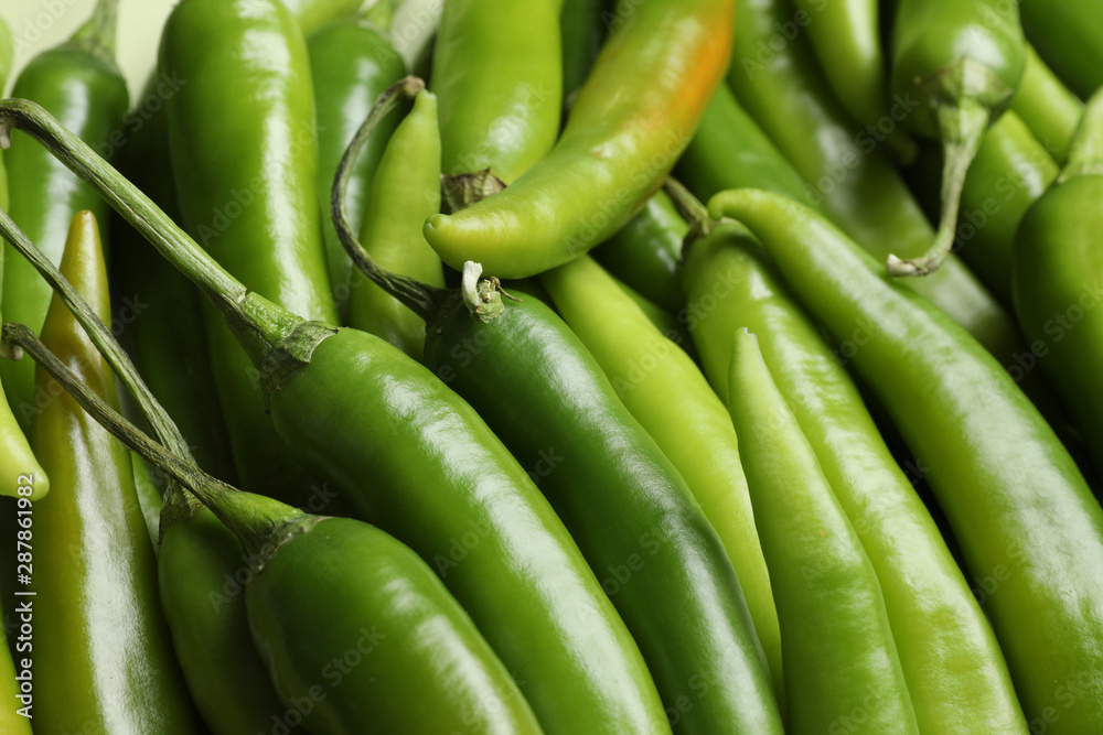 Ripe green chili peppers as background, closeup Ripe green chili peppers as background, closeup