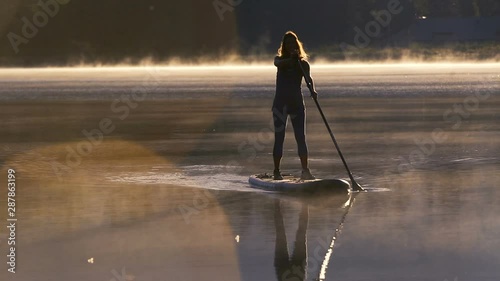 Woman Paddle Boarding on the lake in Whistler