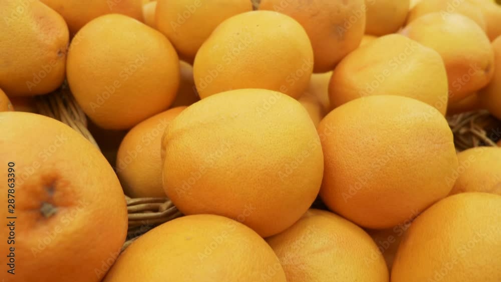 Fresh Oranges Background. close-up. oranges on the counter in the supermarket Fresh Oranges Background. close-up. oranges on the counter in the supermarket