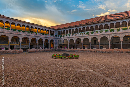 The interior patio of the Qorikancha Sun Temple and Santo Domingo convent famous for its Inca walls and stone work at sunset in the historic city center of Cusco, Peru.