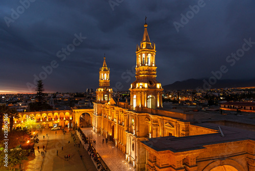 Cityscape of Arequipa after sunset with the illuminated Cathedral and the Plaza de Armas main square, Peru.