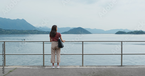 Woman look around the sea © leungchopan