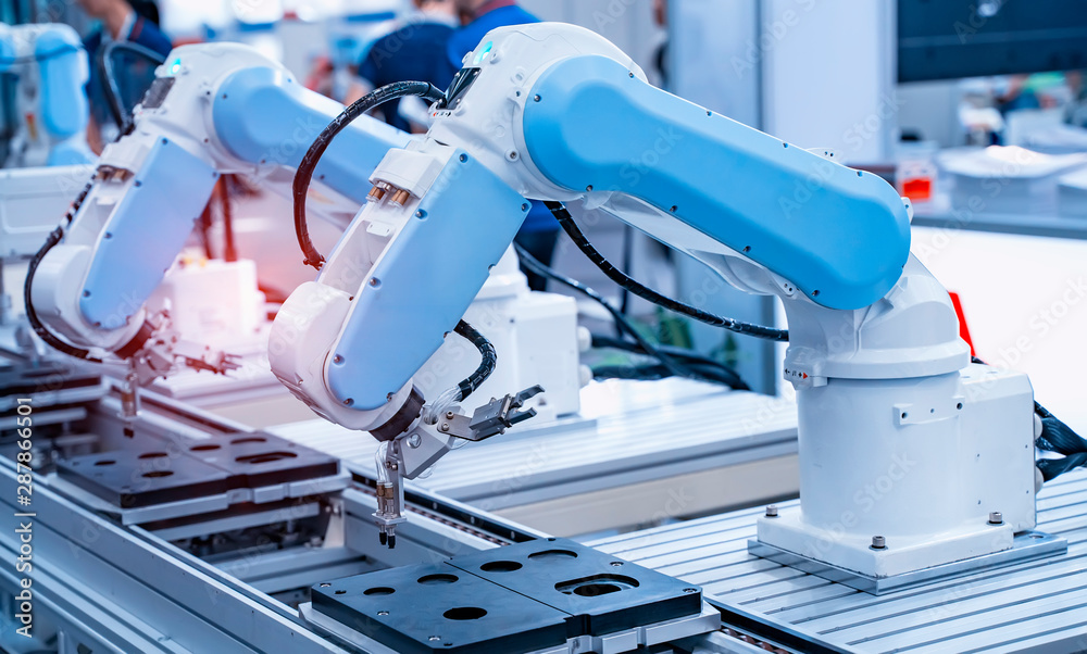 robotic arm catch for electronic assembly line. The robot for smart  technology manufacturing process. Stock Photo | Adobe Stock