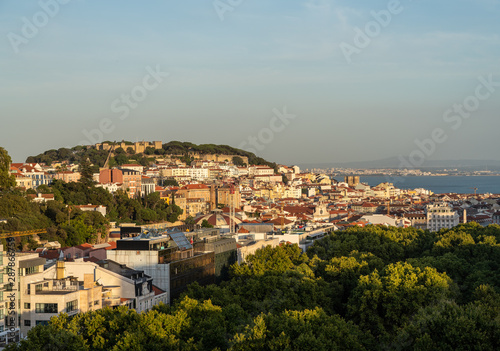 Castle and cathedral in downtown Lisbon illuminated by the setting sun