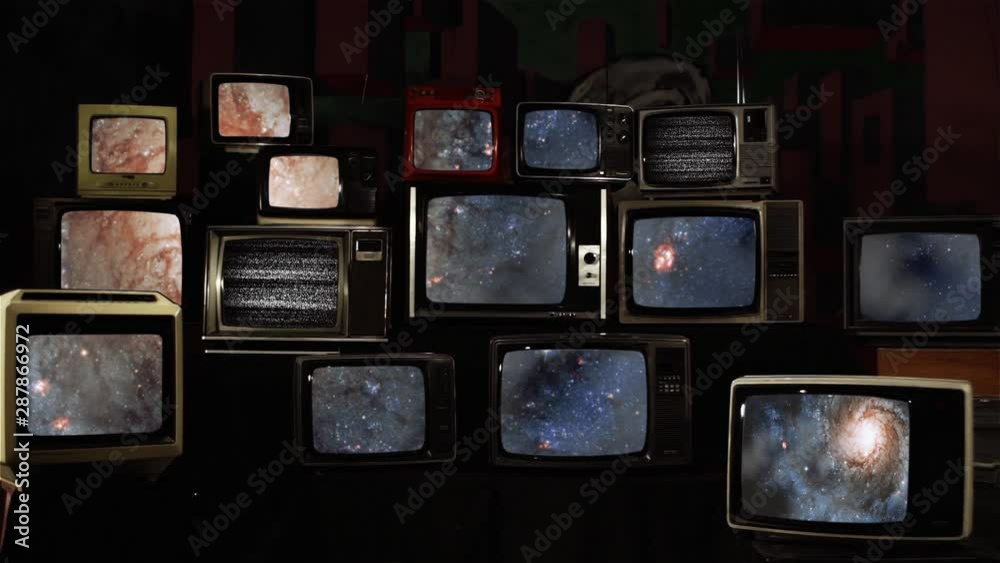 Stacked Retro TVs with a Galaxy as a Background. Elements of this video furnished by NASA. Stacked Retro TVs with a Galaxy as a Background. Elements of this video furnished by NASA.