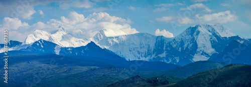 Belukha Mountain is the highest point of Altay. Panoramic view of snow-capped peaks in the evening light.