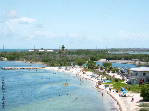 Calusa Beach, Florida Keys, Florida, USA. Bahia Honda State Park. Peopke enjoying the beautiful beach in a hot summer day © christian