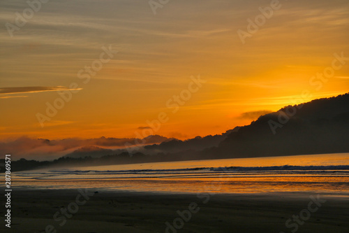 Amazing colorful sunrise at the beach in Costa Rica