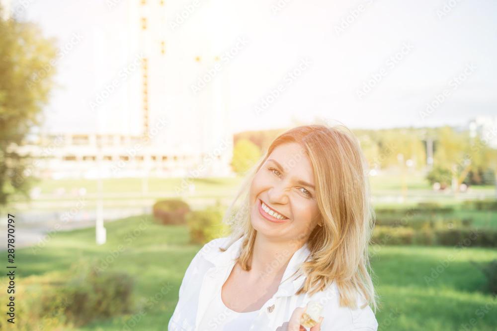 woman eating banana fruit outdoor