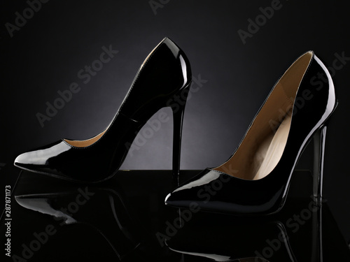 patent leather shoes on dark background. studio fashion