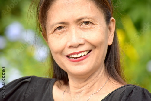 A Filipina Female Senior Smiling