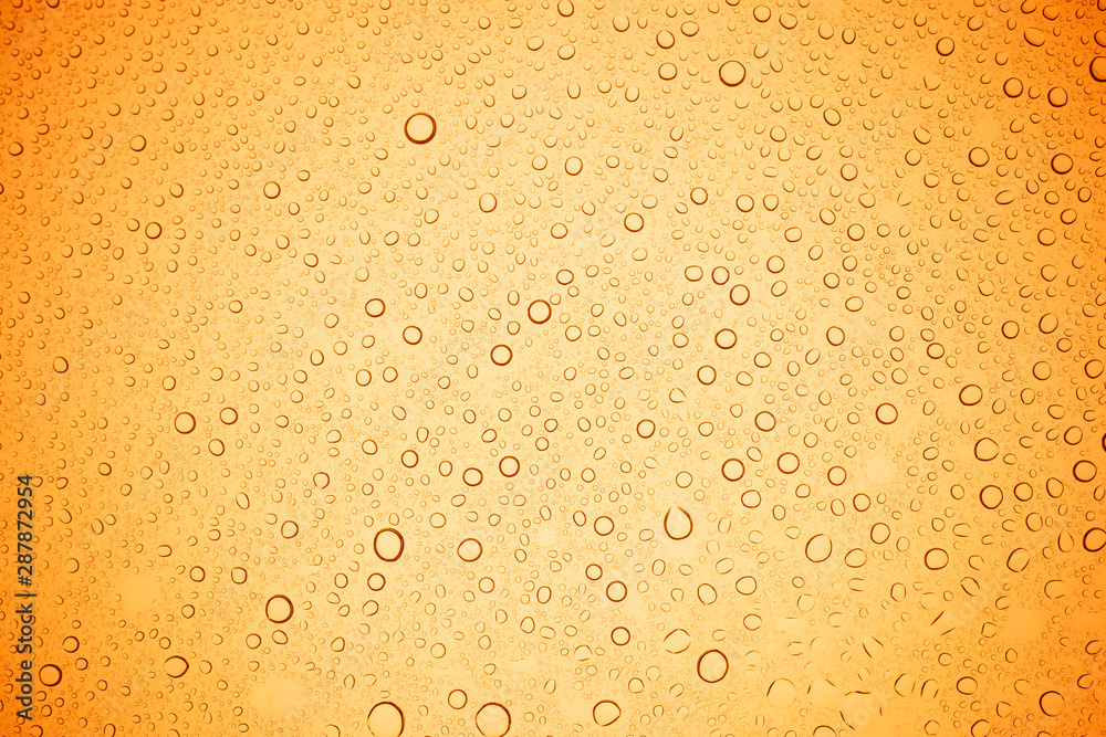 Rain droplets on yellow glass background, Water drops on yellow glass. Rain droplets on yellow glass background, Water drops on yellow glass.