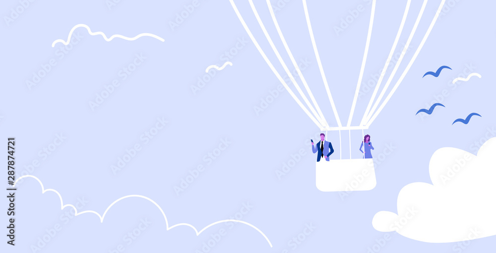 Φωτογραφία couple flying in basket of hot air balloon man woman using smartphone mobile app