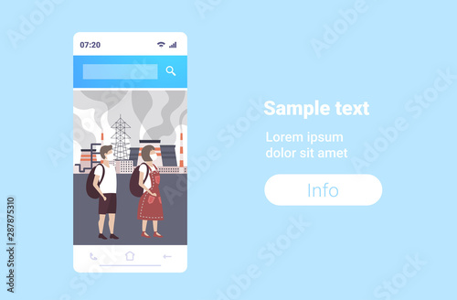 couple in face masks plant pipe dirty waste toxic air pollution industry smog polluted environment concept man woman walking outdoor industrial landscape smartphone screen horizontal full length