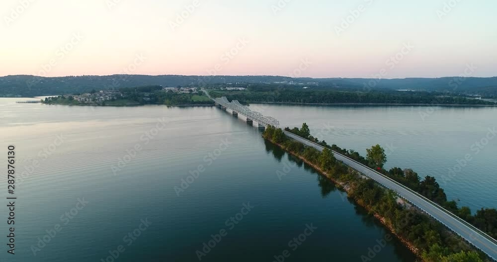 Aerial flight over a lake and highway bridge Aerial flight over a lake and highway bridge