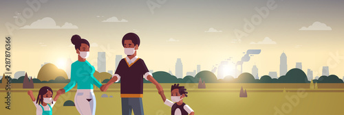 parents and children wearing face masks toxic gas air pollution industry smog polluted environment concept family walking outdoor dirty smoke landscape background portrait horizontal