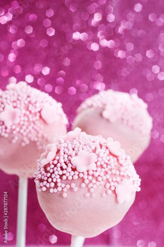 Pink and yellow cake pops.