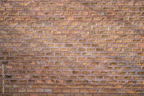 Close up brown brick wall background.