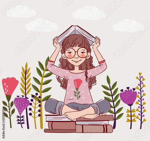Cute, little girl with book in the garden