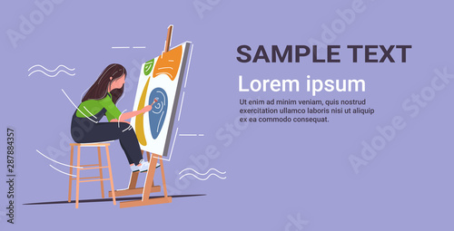 painter using paintbrush and palette woman artist sitting in front of easel art creativity hobby creative occupation concept copy space full length horizontal