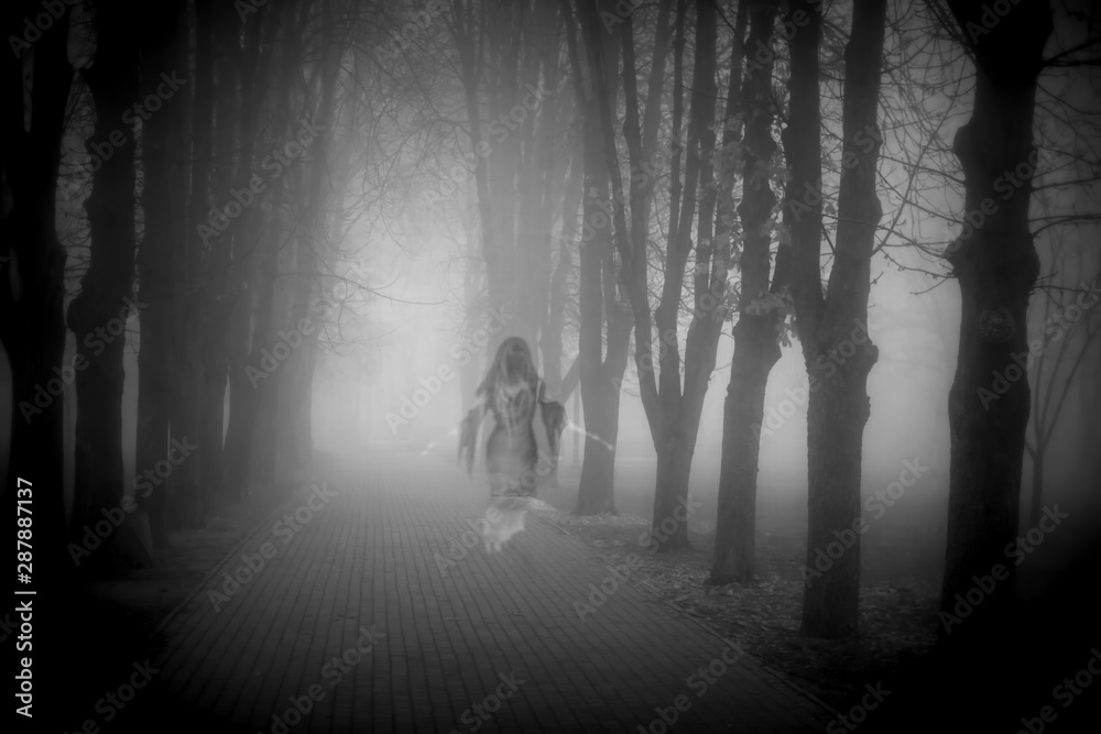 Creepy ghost in a foggy city park
