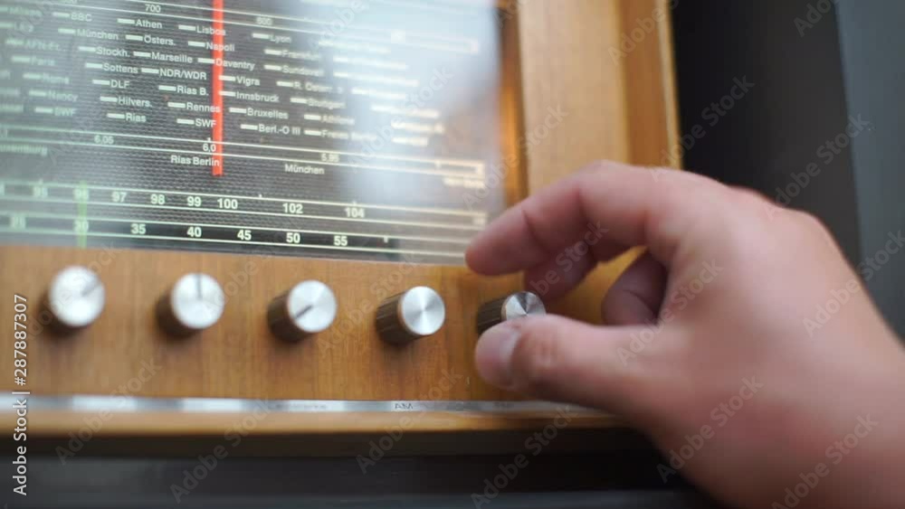 hand that twists the handle of the radio, old radio hand that twists the handle of the radio, old radio