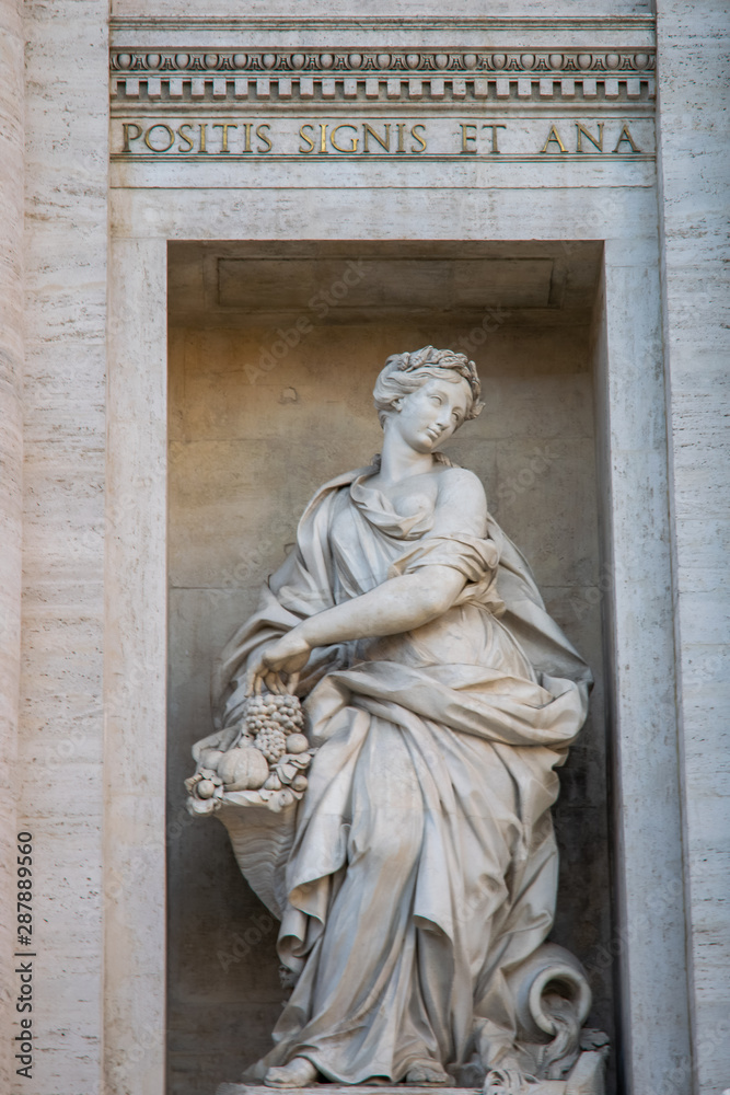 Statue representing the abundance in the Trevi Fountain or Fontana di Trevi in Rome, Italy