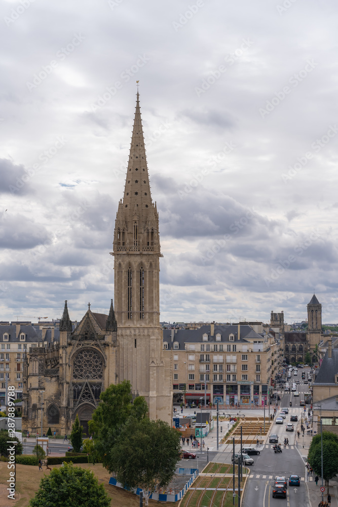 Caen, France - 08 14 2019: Castle of Caen. View of St. Peter's Church and House of Quatrans from the castle