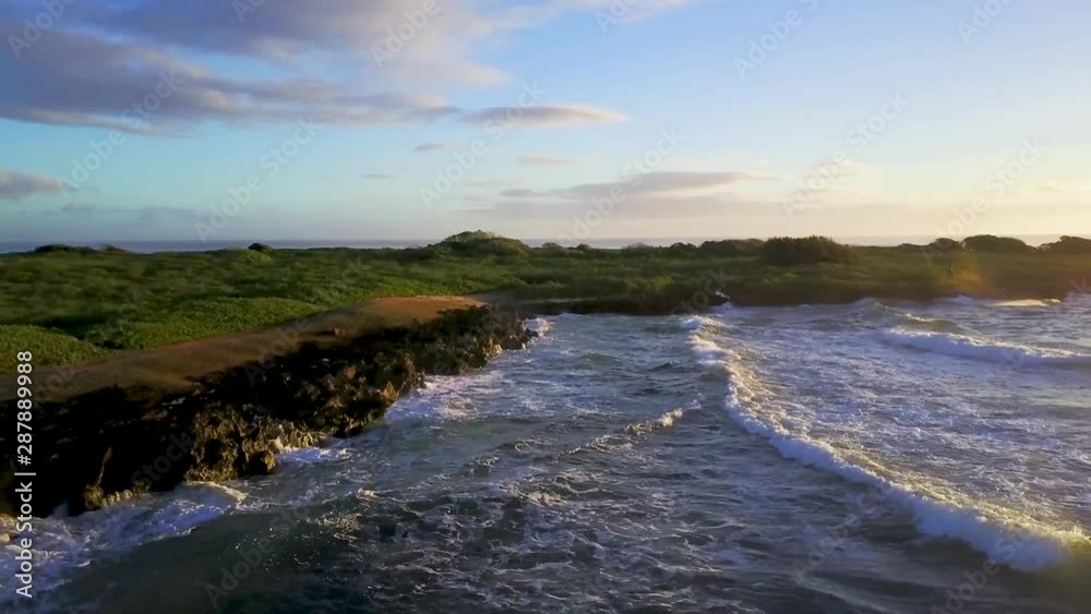 Sunrise aerial shot of ocean and beach with big waves Sunrise aerial shot of ocean and beach with big waves