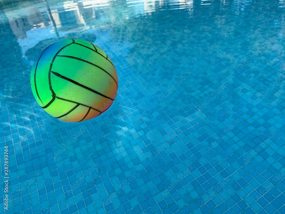 beach volleyball ball in swimming pool. copy space