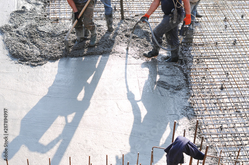 Concrete pouring during commercial concreting floors of buildings in construction