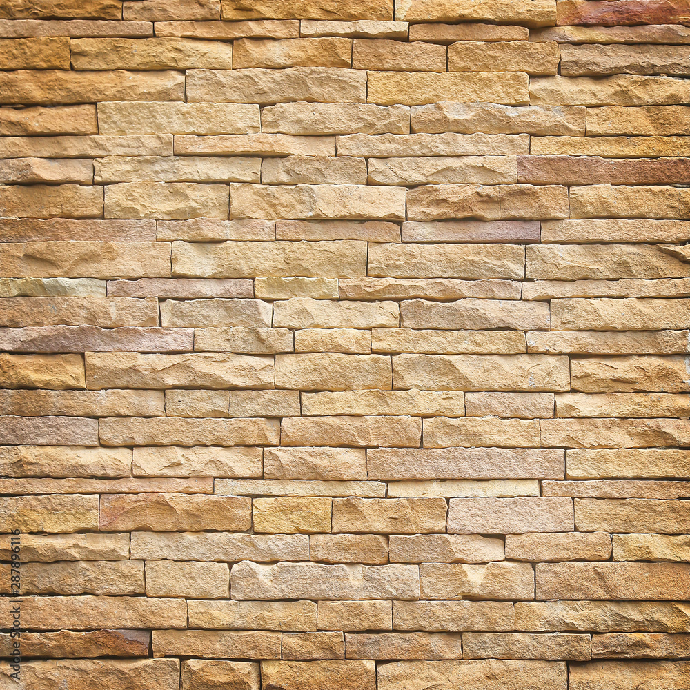 Fototapeta premium Brown stone wall texture background