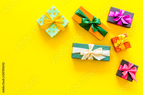gifts frame on yellow background top view mock up