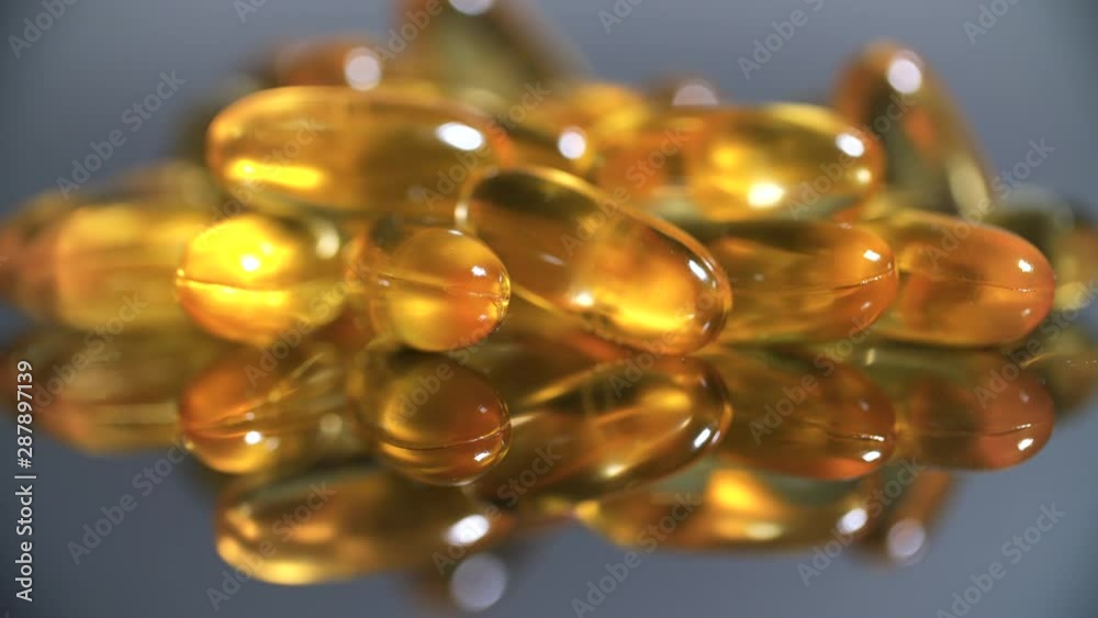 Pile of capsules Omega 3. Close up, top view close up macro Cod liver oil Pile of capsules Omega 3. Close up, top view close up macro Cod liver oil